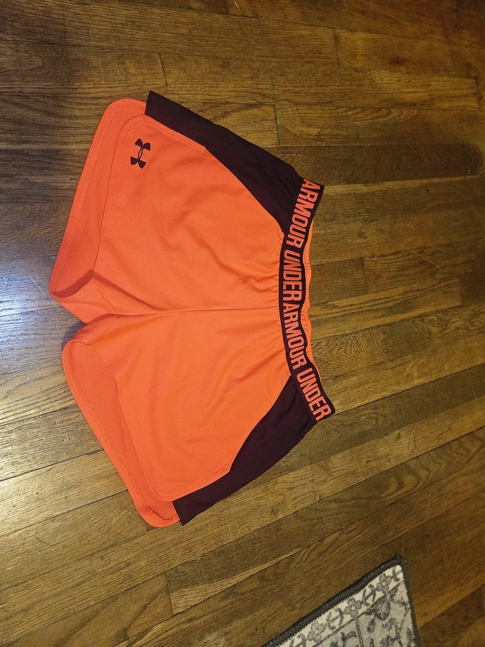 Under Armour Women’s Bright Orange Athletic Shorts with Dark Trim